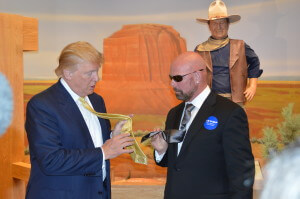 Trump compares ties while John Wayne looks on