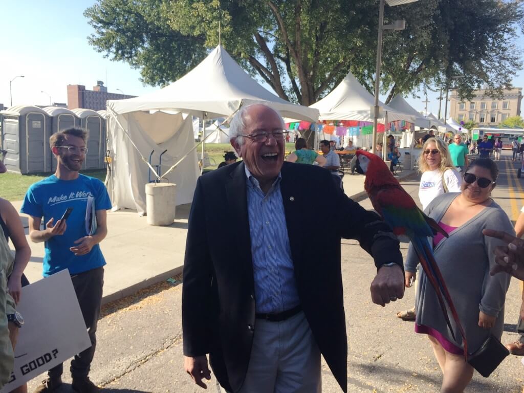 Sanders with a parrot in Des Moines, September 2015