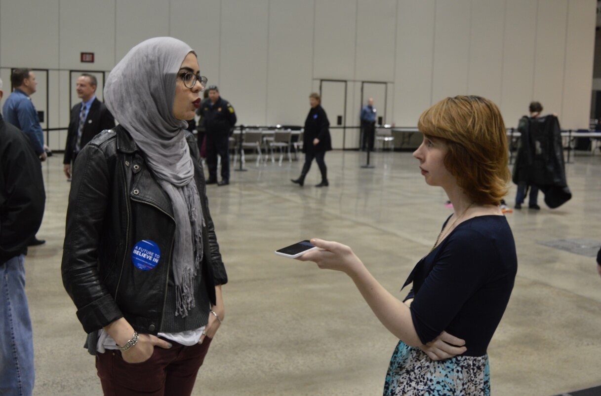 A Sanders supporter is interviewed at the Kansas City rally