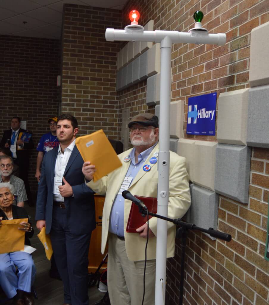 A delegate waits to speak