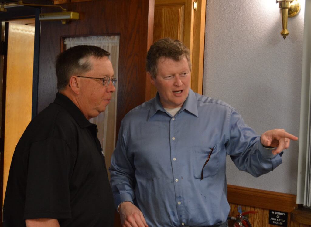 Murphy talks with supporters at a fundraiser for the Labor Harvest shelter