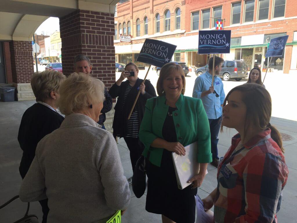 Monica Vernon with her team at the debate