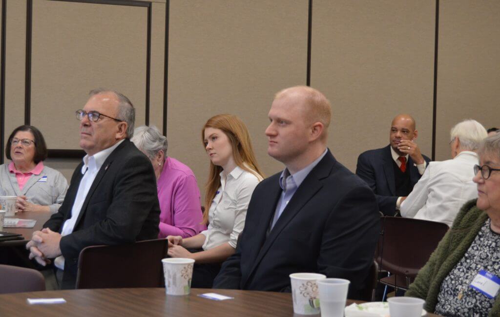 The three candidates await to turn to talk at Plymouth