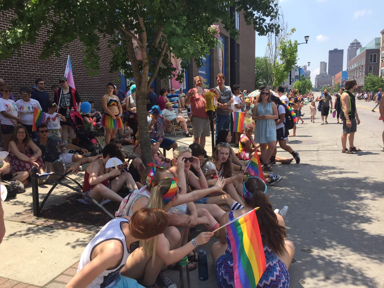 Crowds line the street for the Pridefest parade, despite the heat