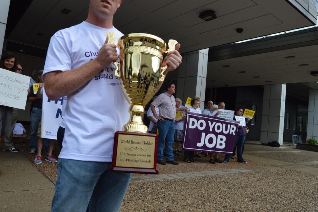 Rally-goers made a mock trophy for Grassley's new record